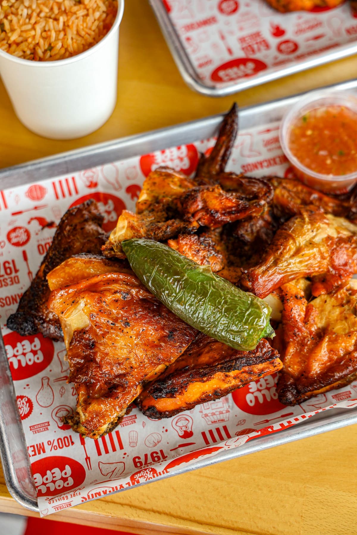 Family meal tray of pollo asado with sides