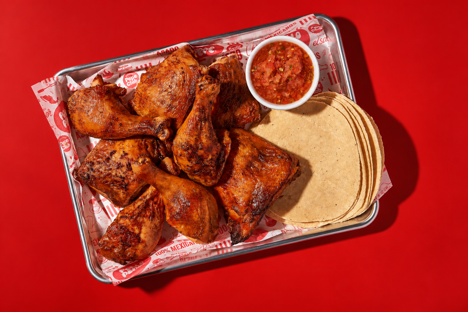 Pollo asado on the Pollo Pepe tray with salsa and warm tortillas
